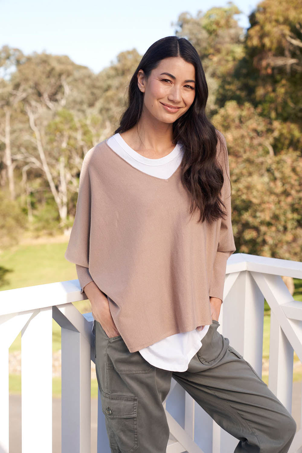 A model wearing the Destiny Knit Jumper in colour Latte, from the front, showing the whole outfit