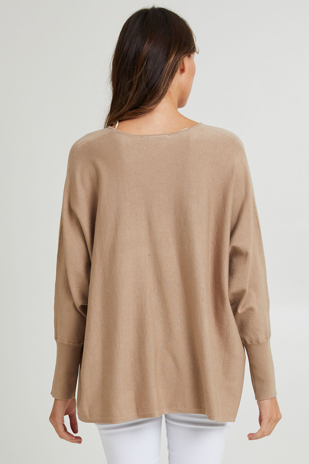 Model Madeline wearing size 10 of the Destiny Knit Jumper in colour Latte, from the back