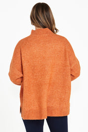 A model wearing the Luna Knit Jumper in colour Amber, from the back