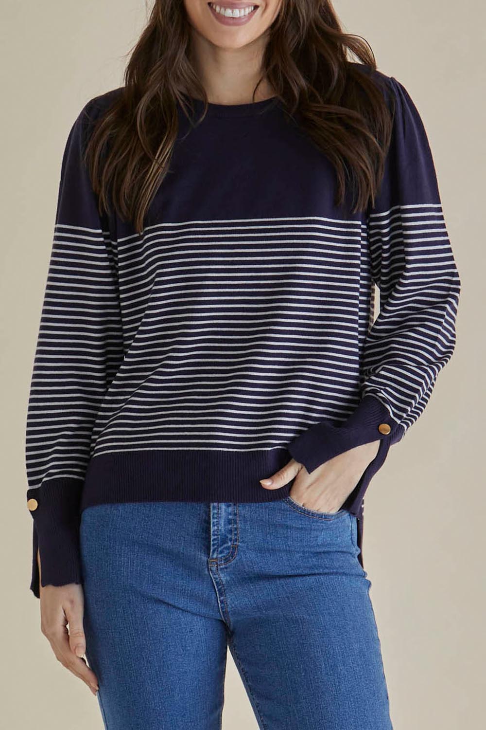 A model wearing the Colette Sweater in colour Bluecream (Blue), from the front, cropped image