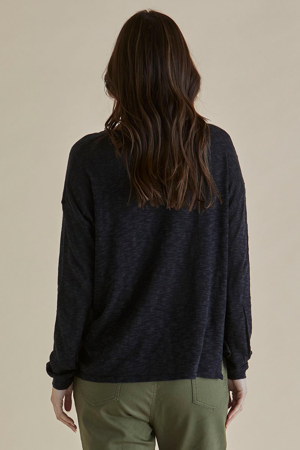 A model wearing the Natasha Cotton Blend Knit Top in colour Black (Black), from the back