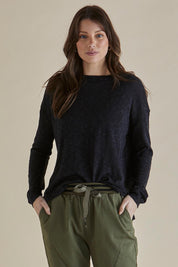 A model wearing the Natasha Cotton Blend Knit Top in colour Black (Black), from the front, cropped image