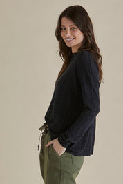 A model wearing the Natasha Cotton Blend Knit Top in colour Black (Black), from the front, cropped image