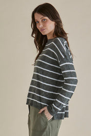 A model wearing the Natasha Cotton Blend Knit Top in colour Green (Green), from the front, cropped image