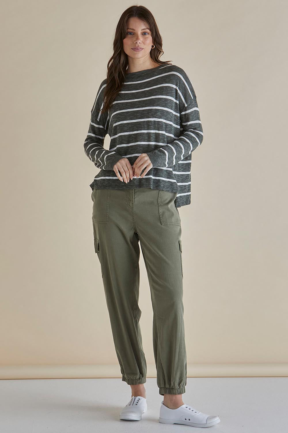 A model wearing the Natasha Cotton Blend Knit Top in colour Green (Green), from the front, showing the whole outfit