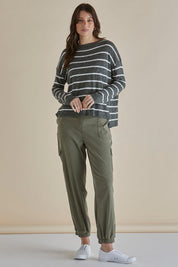 A model wearing the Natasha Cotton Blend Knit Top in colour Green (Green), from the front, showing the whole outfit