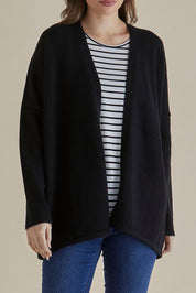 A model wearing the Emy Cardigan in colour Black (Black), from the front, cropped image