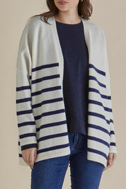 A model wearing the Emy Cardigan in colour Bluestripe (Blue), from the front, cropped image