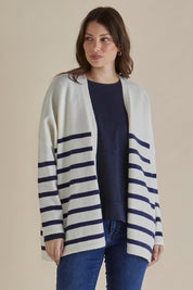 A model wearing the Emy Cardigan in colour Bluestripe (Blue), from the front, cropped image