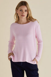 A model wearing the Cable Mini Jumper in colour Babypink (Pink), from the front, cropped image