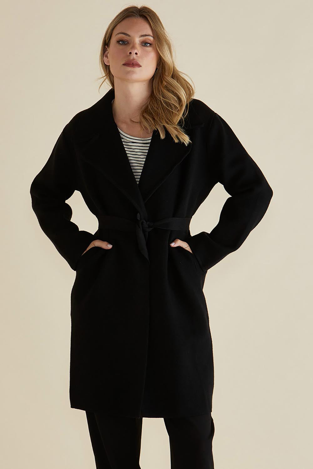 A model wearing the Cosette Jacket in colour Black (Black), from the front, cropped image