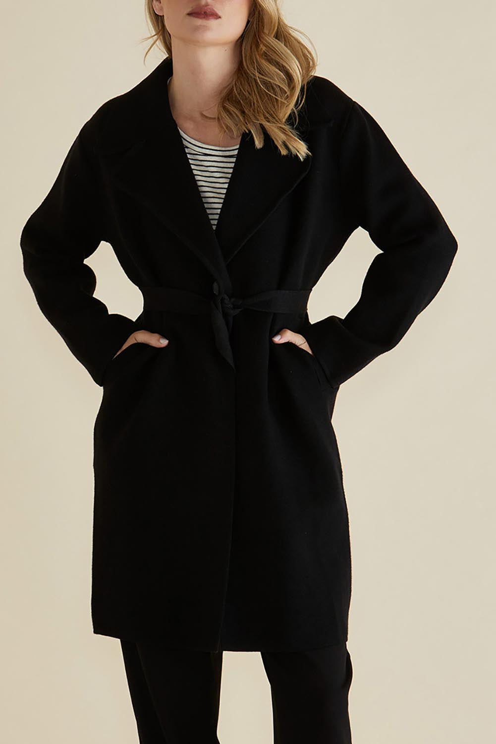 A model wearing the Cosette Jacket in colour Black (Black), from the front, cropped image