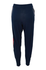 Product shot of the Aida Knit Pant in colour Navy (Blue), from the back