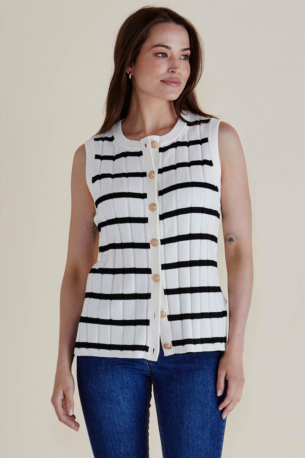 A model wearing the Nicollete Cotton Knit Vest in colour Blkstripe (White), from the front, showing the whole outfit