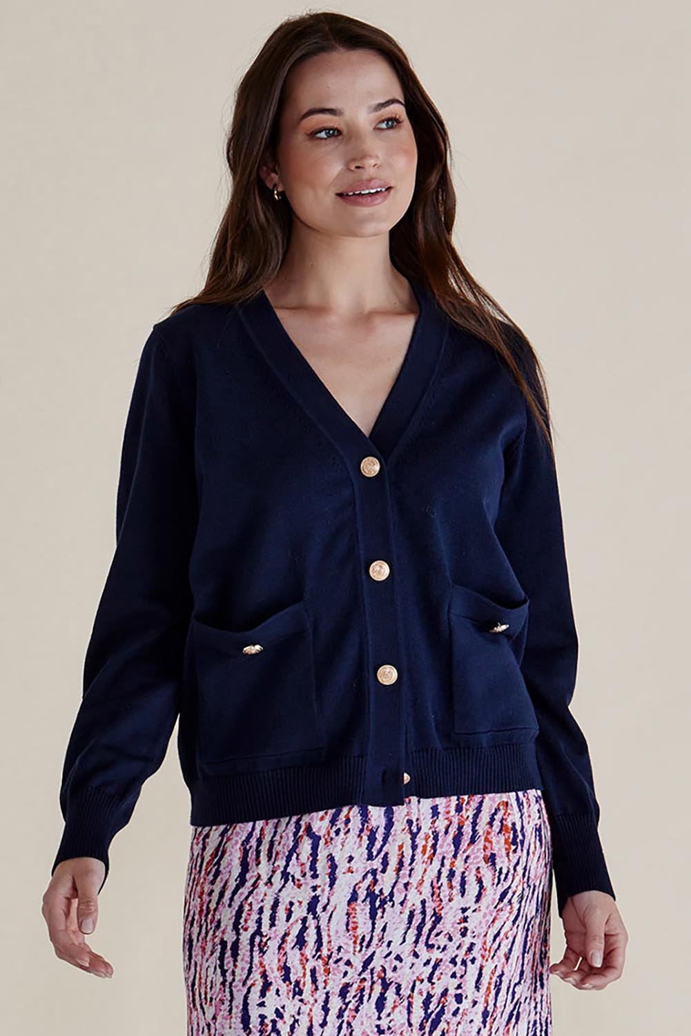 A model wearing the Leon Cotton Blend Knit Cardigan in colour Navy (Blue), from the front, cropped image