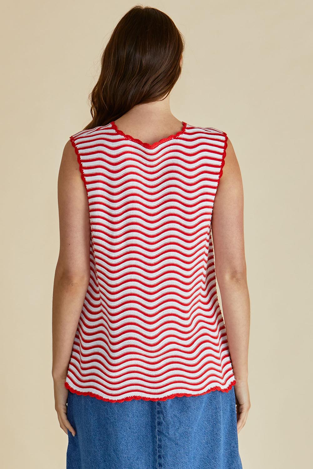 A model wearing the Aviva Cotton Tank in colour Redwhite (Red), from the back
