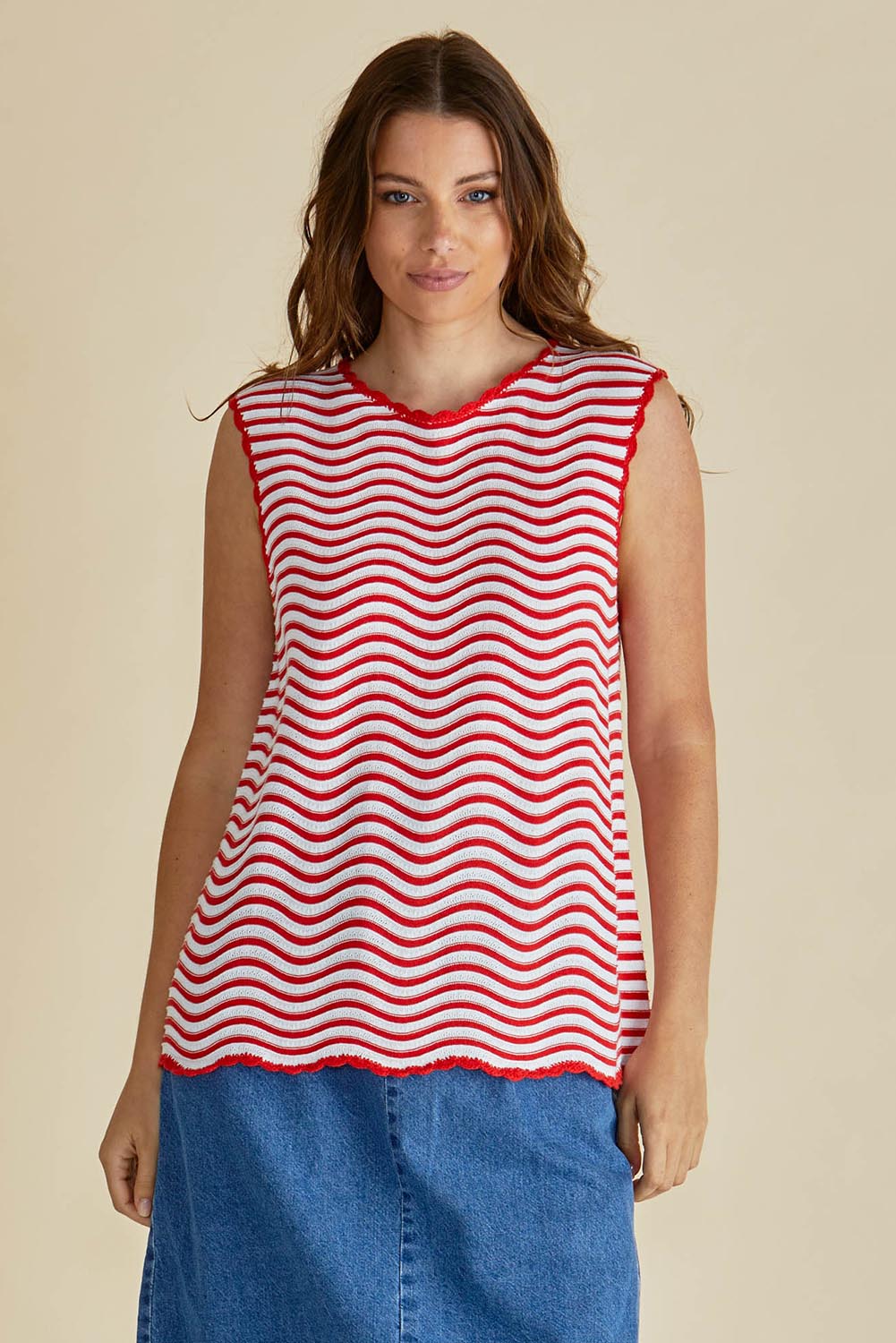 A model wearing the Aviva Cotton Tank in colour Redwhite (Red), from the front, cropped image