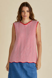A model wearing the Aviva Cotton Tank in colour Redwhite (Red), from the front, cropped image