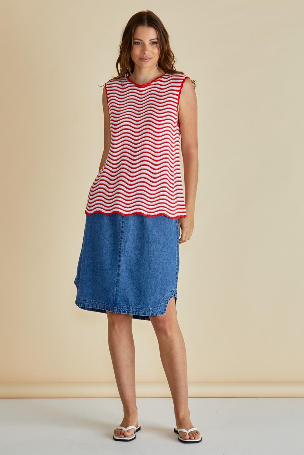 A model wearing the Aviva Cotton Tank in colour Redwhite (Red), from the front, showing the whole outfit