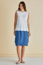 A model wearing the Aviva Cotton Tank in colour White (White), from the front, showing the whole outfit