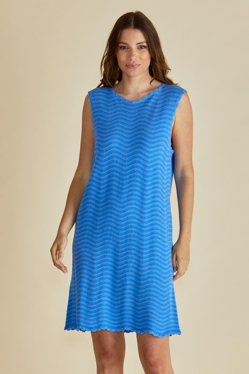 A model wearing the Viola Cotton Tank Dress in colour Blue (Blue), from the front, cropped image