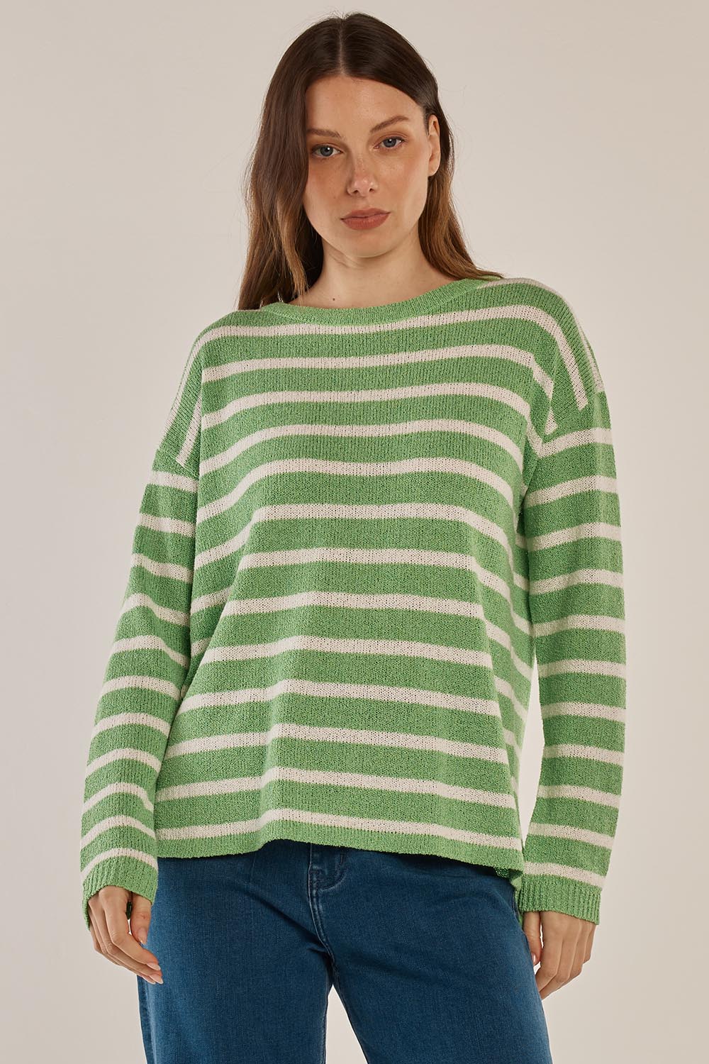 A model wearing the Bradford Knit Top in colour Greencream (Green), from the front, cropped image