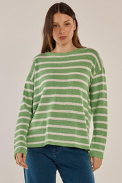 A model wearing the Bradford Knit Top in colour Greencream (Green), from the front, cropped image