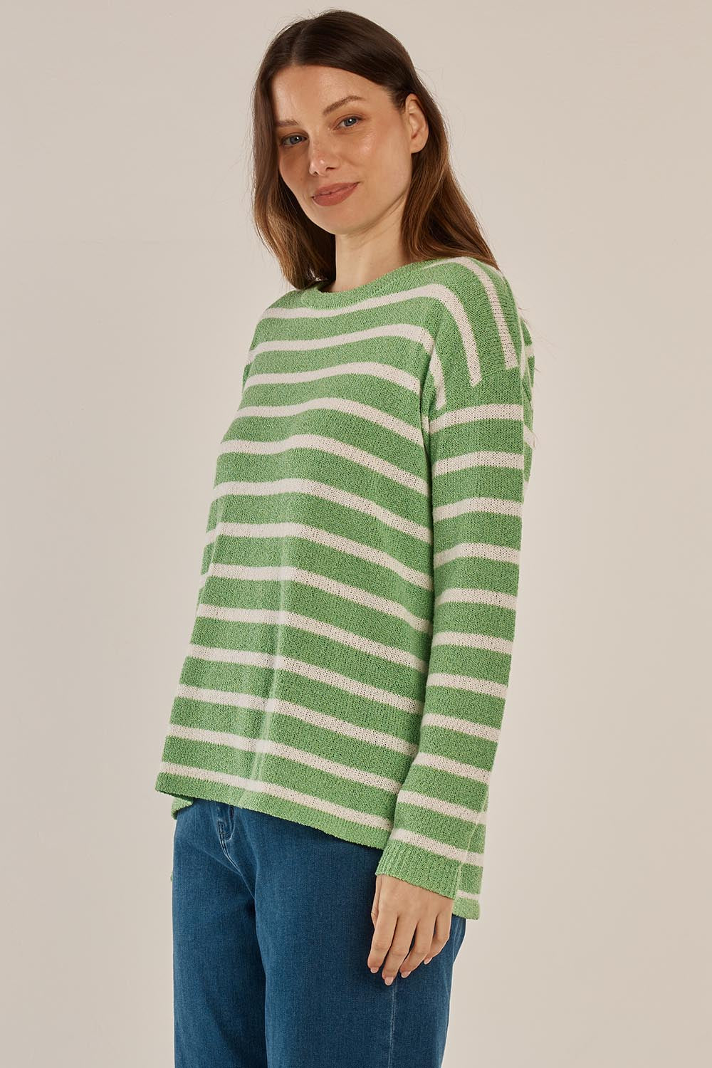 A model wearing the Bradford Knit Top in colour Greencream (Green), from the front, cropped image
