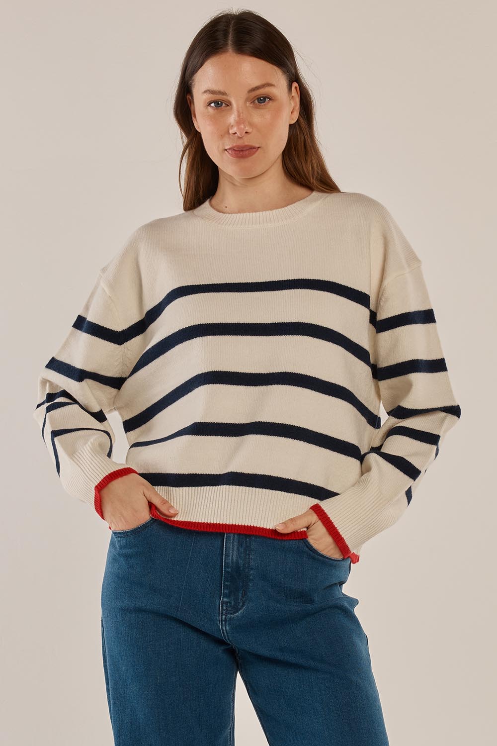 A model wearing the Leonie Knit Sweater in colour Navywhite (White), from the front, cropped image