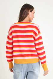 Model Madeline wearing size 10 of the Leonie Knit Sweater in colour Redpink (Red), from the back