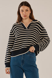 A model wearing the Aberdeen Polo Knit Sweat in colour Navystripe (Blue), from the front, cropped image