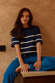 A model wearing the Bailey Boxy Sweater in colour Navy (Blue), from the front, cropped image
