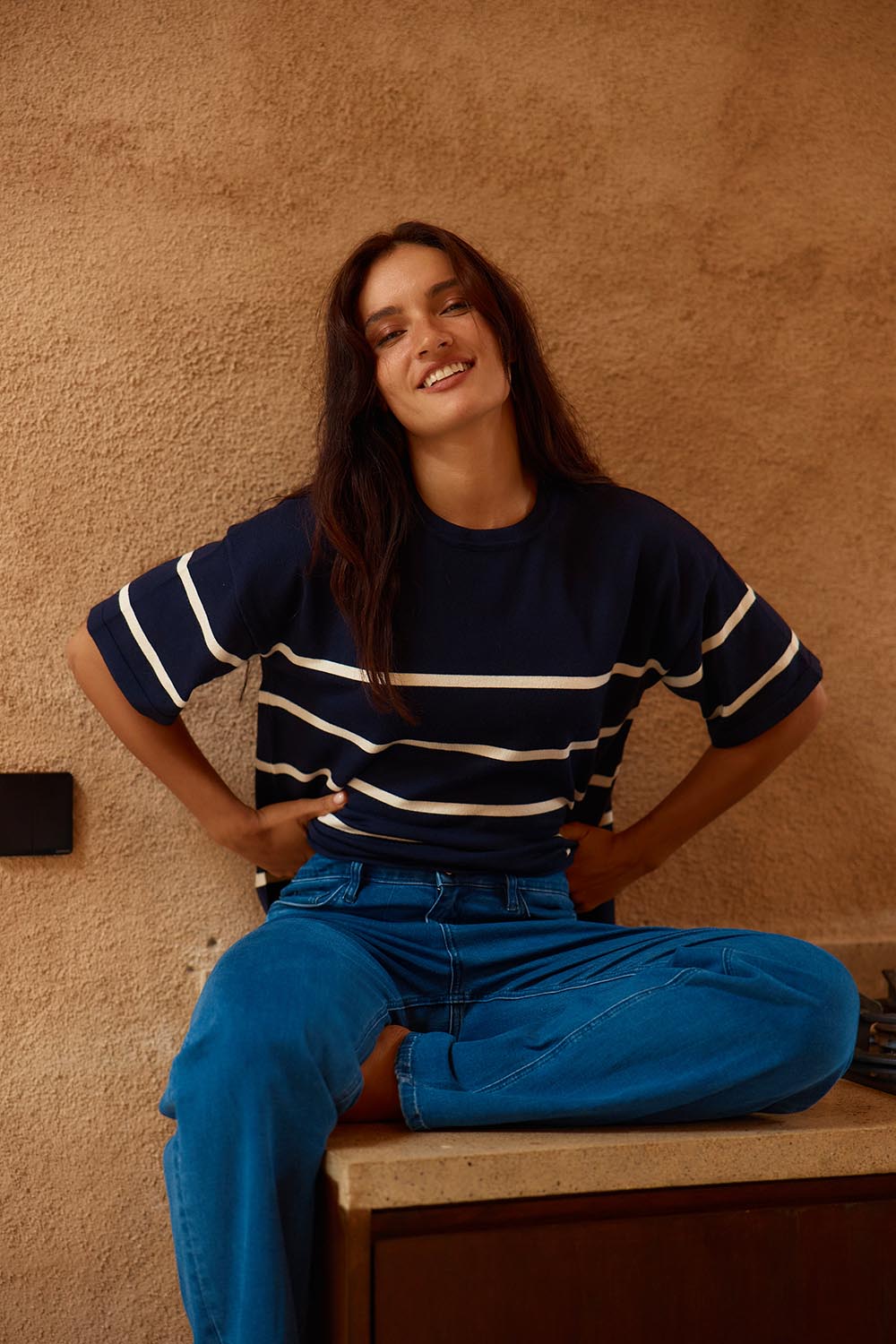 A model wearing the Bailey Boxy Sweater in colour Navy (Blue), from the front, cropped image