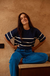 A model wearing the Bailey Boxy Sweater in colour Navy (Blue), from the front, cropped image
