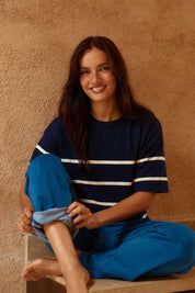 A model wearing the Bailey Boxy Sweater in colour Navy (Blue), from the front, cropped image