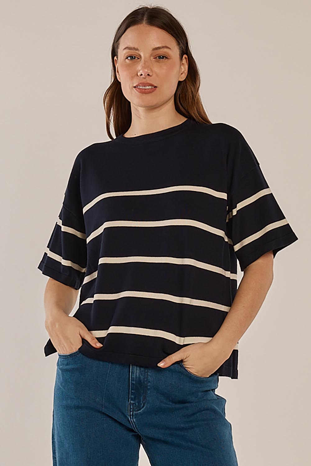 A model wearing the Bailey Boxy Sweater in colour Navy (Blue), from the front, cropped image
