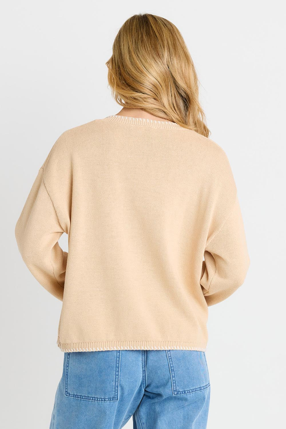 Model Genericm wearing size sample of the Ascot Stitch Sweater – Cream in colour Cream, from the back