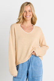 Model Genericm wearing size sample of the Ascot Stitch Sweater – Cream in colour Cream, in a cropped view