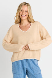 Model Genericm wearing size sample of the Ascot Stitch Sweater – Cream in colour Cream, in a cropped view