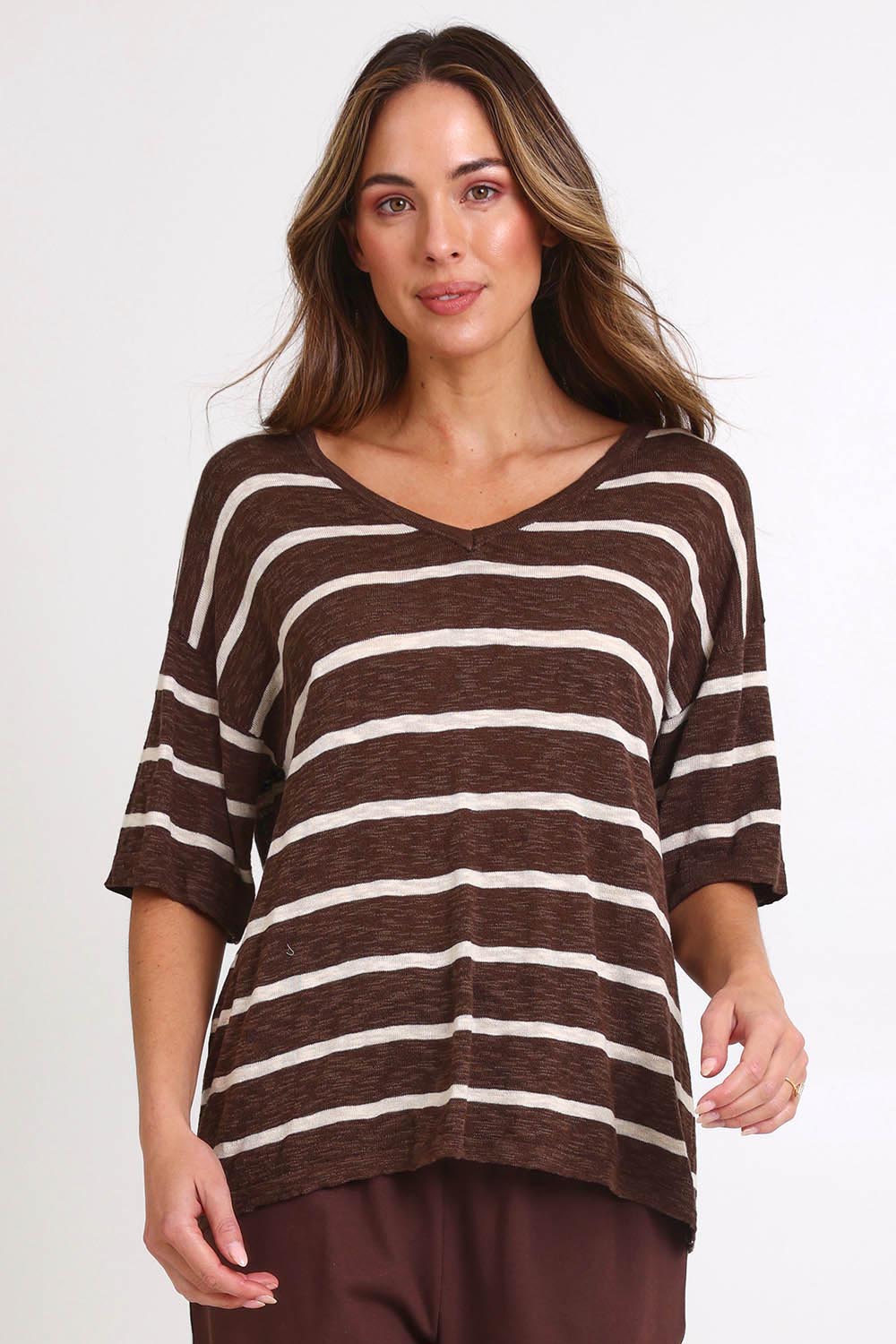 Model Madelinec wearing size 10 of the Aries V-Neck Sweater Tee – Chocolate in colour Chocolate, in a cropped view