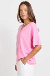 Model Genericm wearing size sample of the Aries V-Neck Sweater Tee – Pink in colour Pink, from an angle
