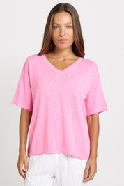 Model Genericm wearing size sample of the Aries V-Neck Sweater Tee – Pink in colour Pink, in a cropped view