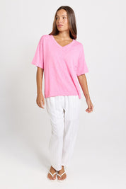 Model Genericm wearing size sample of the Aries V-Neck Sweater Tee – Pink in colour Pink, from the front