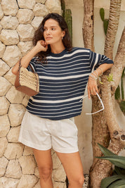 Model Genericm wearing size sample of the Dylan Knit Tee – Navywhite in colour Navywhite, from an angle