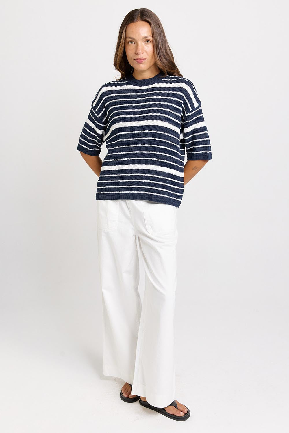 Model Genericm wearing size sample of the Dylan Knit Tee – Navywhite in colour Navywhite, from the front