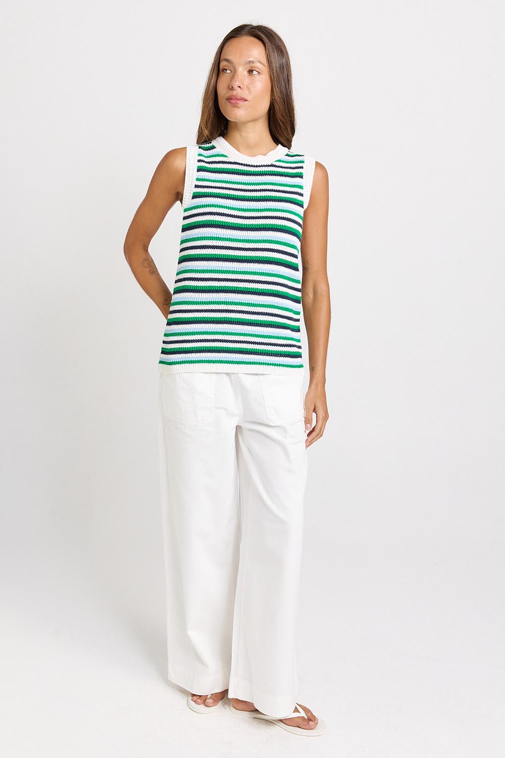 Model Genericm wearing size sample of the Roni Tank – Bluegreen in colour Bluegreen, from the front
