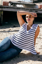A model wearing the Jamie Tank in colour Whiteindi (White), from the front, showing the whole outfit