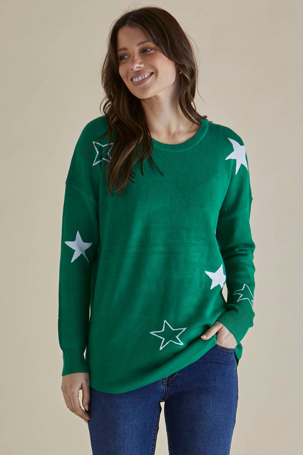 A model wearing the Sophie Knit Jumper in colour Greenstar (Green), from the front, cropped image
