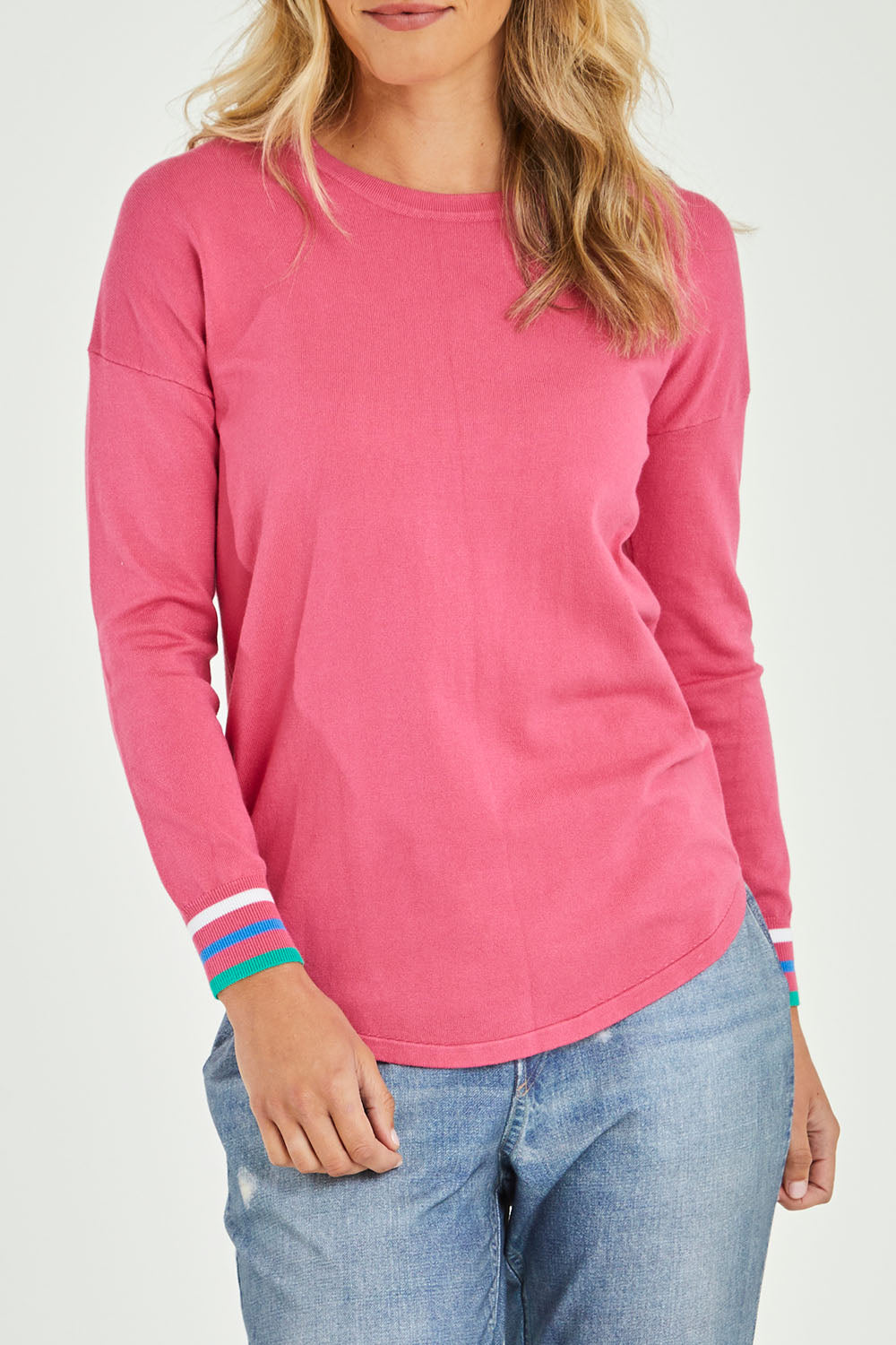 Model Alice wearing size 10 of the Sophie Knit Jumper in colour Rosa (Pink), from the front, cropped image