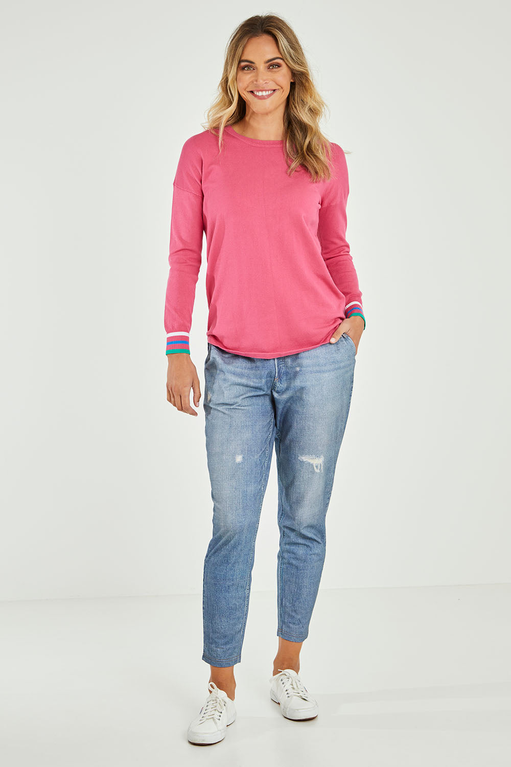 Model Alice wearing size 10 of the Sophie Knit Jumper in colour Rosa (Pink), from the front, showing the whole outfit
